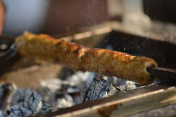 Roasting Chicken Seekh Kabab (Indian Mughlai Delicacy) on coal 