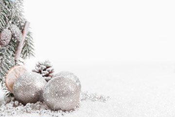 Fototapeta na wymiar Christmas balls and fir branches with snow 