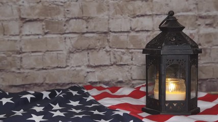 The flag of the United States and lighted candles, background
