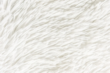 Fluffy plaid of polyester with a long heap gray. Comfortable home textiles. Background, texture