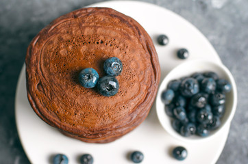 Chocolate Pancakes with Blueberry on grey background, Homemade Dessert, Sweet Breakfast