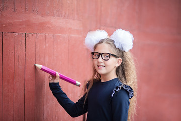 Portrait of a beautiful young Schoolgirl. Farewell Bell. day of knowledge. beginning of the school...