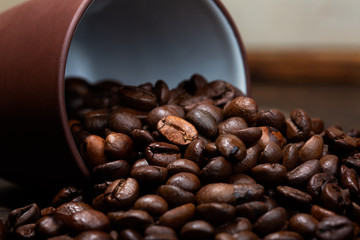 Frament of coffee beans on old table.