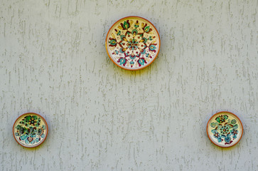 Painted plates on the wall.
