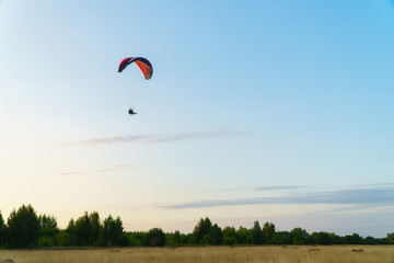 Paraplane on the blue sky background, leisure activity.