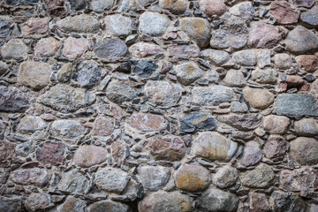 Stone wall of rough unprocessed stones