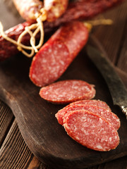 Sliced salami on cutting board