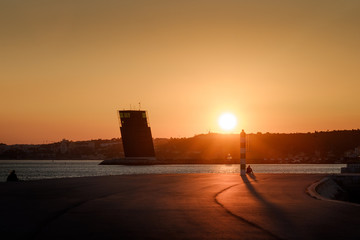 Sunset over a pier in Lisbon
