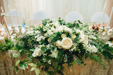 Magic wedding decor on the tables of the bride and groom, white and blue color, beautiful details, selective focus