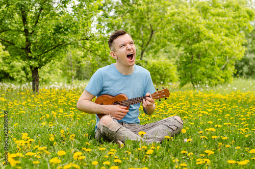 AND SINGS THE GRASS