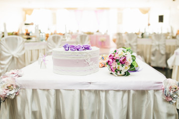 Table for giving newlyweds. Wedding candy boxes, white. Gifts to guests. Wedding decor, style, selective focus.