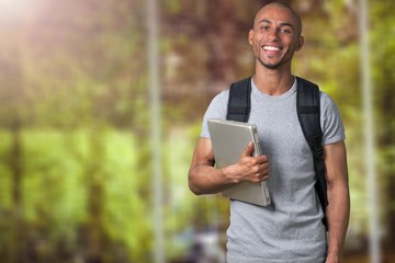 Smiling African Student man with laptop