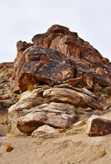 A pile of rocks with petroglyphs carved into them