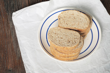 Wheat bread with bran on table