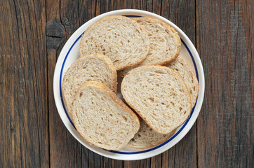 Slices of bread with bran in a plate