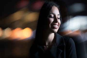 Smiling unusual woman in night city