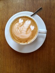 Cappuccino with beautiful froth art, directly above