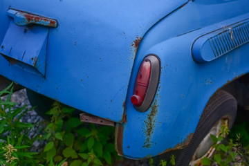 Rear part of bright blue old automobile