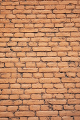 Wall from yellow bricks background texture abstract