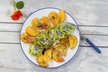 Ancient Tomatoes. Salad of various and colorful Ancient tomatoes