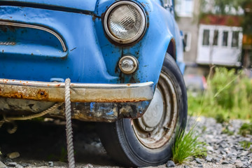 Side part of bright blue old automobile