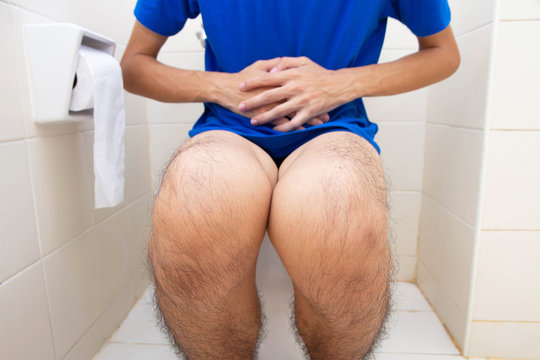 Man diarrhea sitting on toilet