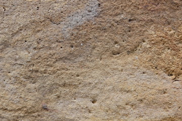 Texture of a stone wall. Vintage background. A wall of medieval buildings. Abstract pattern with a natural material. Blank for design
