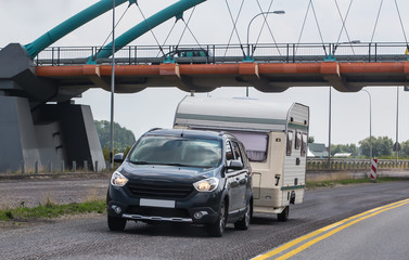 Naklejka premium car with a camping trailer