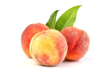 Natural peach with leaf isolated.