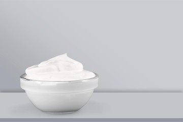 Fototapeta na wymiar close up of a white beauty cream or yogurt on white background