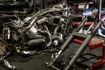 Professional auto repair service in the process of repairing a motorcycle.