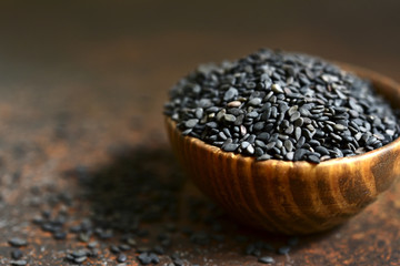 Fototapeta na wymiar Black sesame seed in a wooden bowl.