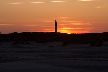 Sunset behind lighthouse
