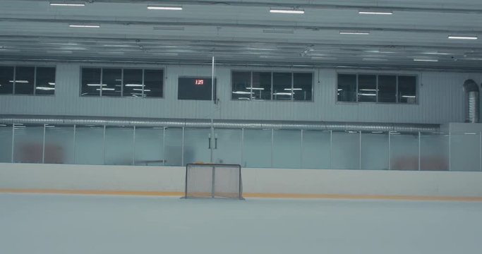 DOLLY OUT View of an empty hockey rink, no players. 4K UHD