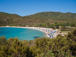 Fototapeta na wymiar Villasimius, Italy - August 18, 2017: Transparent and turquoise sea in Cala Sinzias, Villasimius. Sardinia Italy