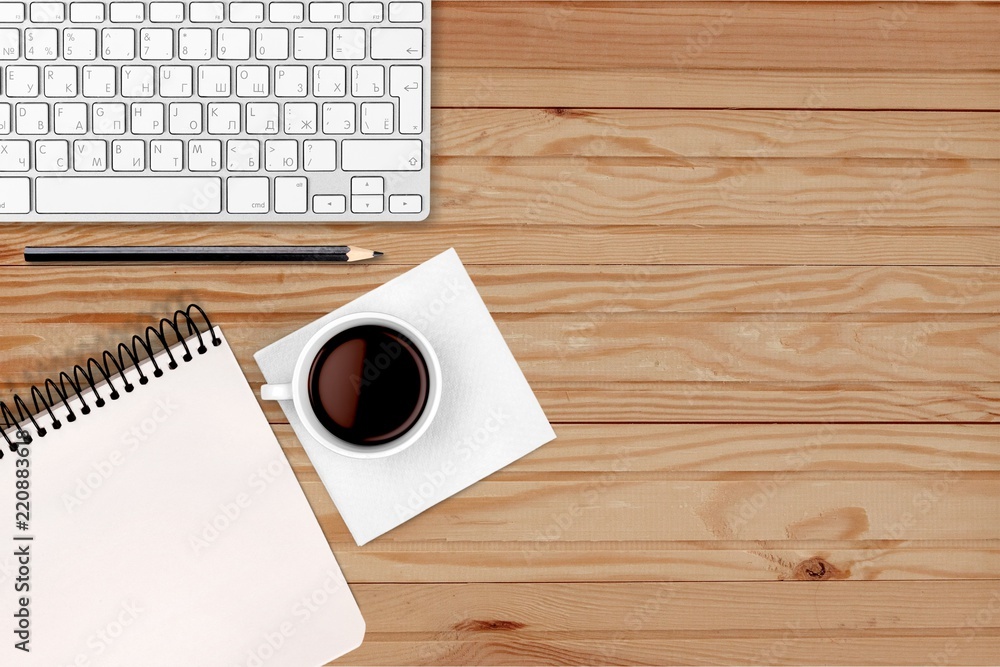 Poster computer keyboard at workplace and cup isolated on background