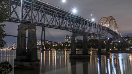 Patullo Bridge, Surrey, British Columbia, Canada. Long exposure of the bridge over the water. Sky Train Bridge.