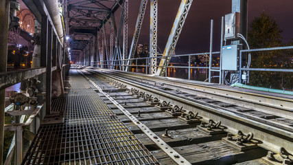 Patullo Bridge, Surrey, British Columbia, Canada. Long exposure of the bridge over the water. Sky Train Bridge.