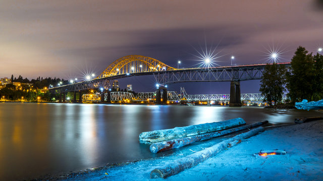 Patullo Bridge, Surrey, British Columbia, Canada. Long exposure of the bridge over the water. Sky Train Bridge.