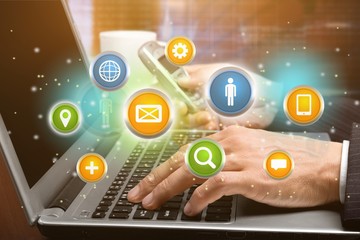 Young business man in suit working with laptop