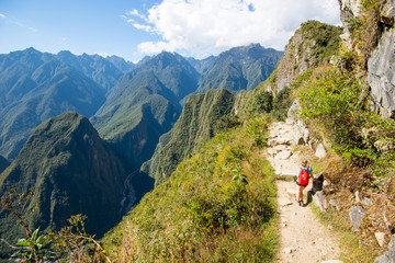 Hiking on mountain stone road in Machu Picchu sun gate trail
