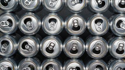 Stack of empty aluminum beer cans, front side view, close up, macro.