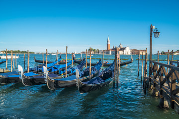 view of gondolas and San Giorgio church as background in Venice, Italy