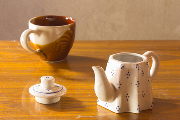 still life classic ceramic kettle with cup