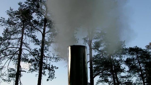 The smoke before I bought them from a metal chimney. Column of smoke

