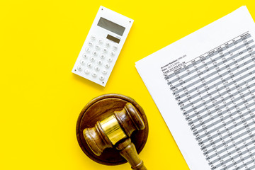 Declare bankruptcy concept. Judge gavel, financial documents, calculator on yellow background top view copy space