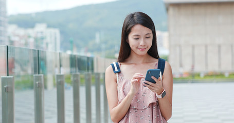 Fototapeta premium Woman use smart phone in the city