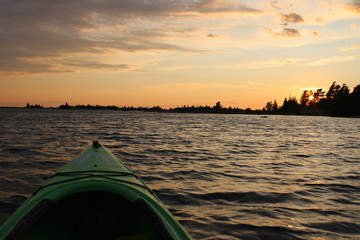 Sunset on Georgian Bay at Parry Sound view from kayak with ripples in the water