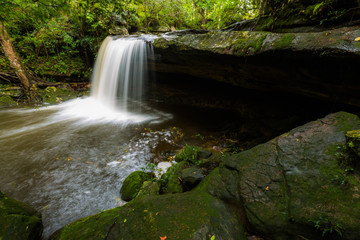 Waterfall in thai national park. In the deep forest on mountain.	