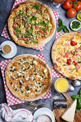 Breakfast gourmet pizzas on the table